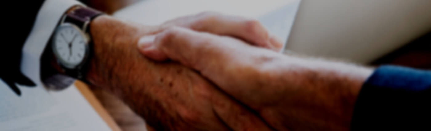Onboarding deal agreed between two businessmen shaking hands.